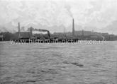 Pleasure-Streamer passing Woowich, with Chimneys of the Woolwich Arsenal munitions Factory, Woolwich, London. c.1890's