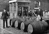 The Gaugers at work with wine casks London Docks London. c.1890's.